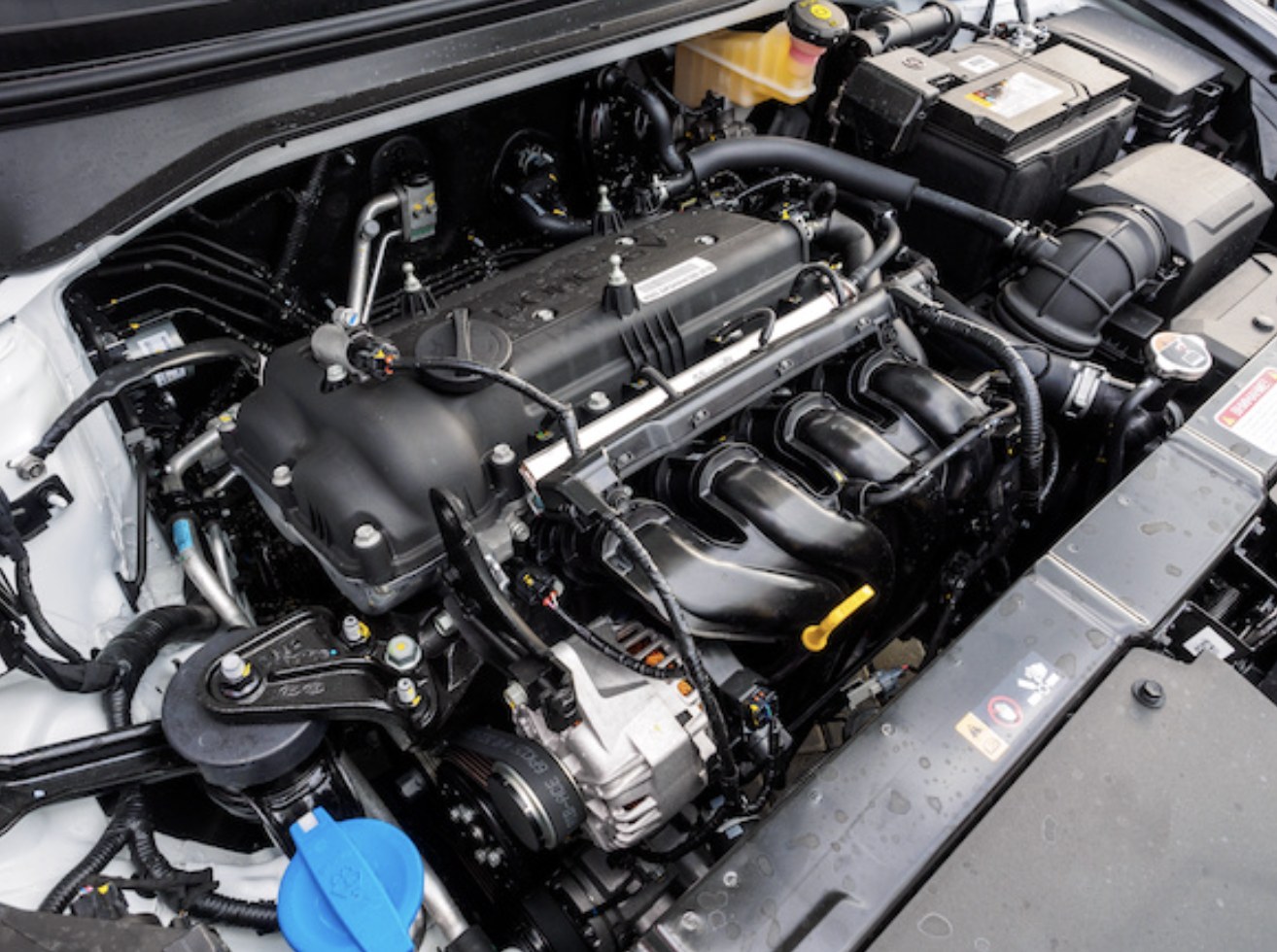 Everett mobile mechanic inspecting a customer's engine bay